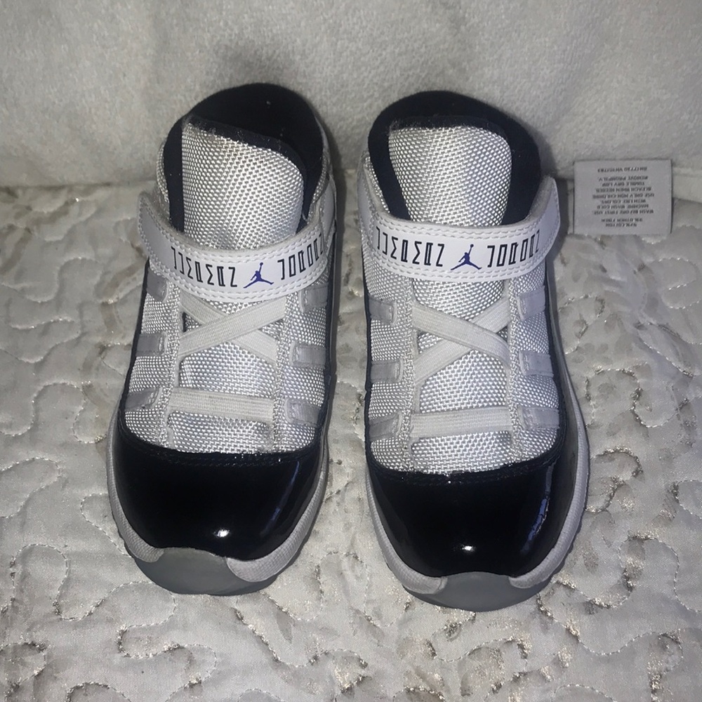 White With black patent leather Jordan’s. Size 10